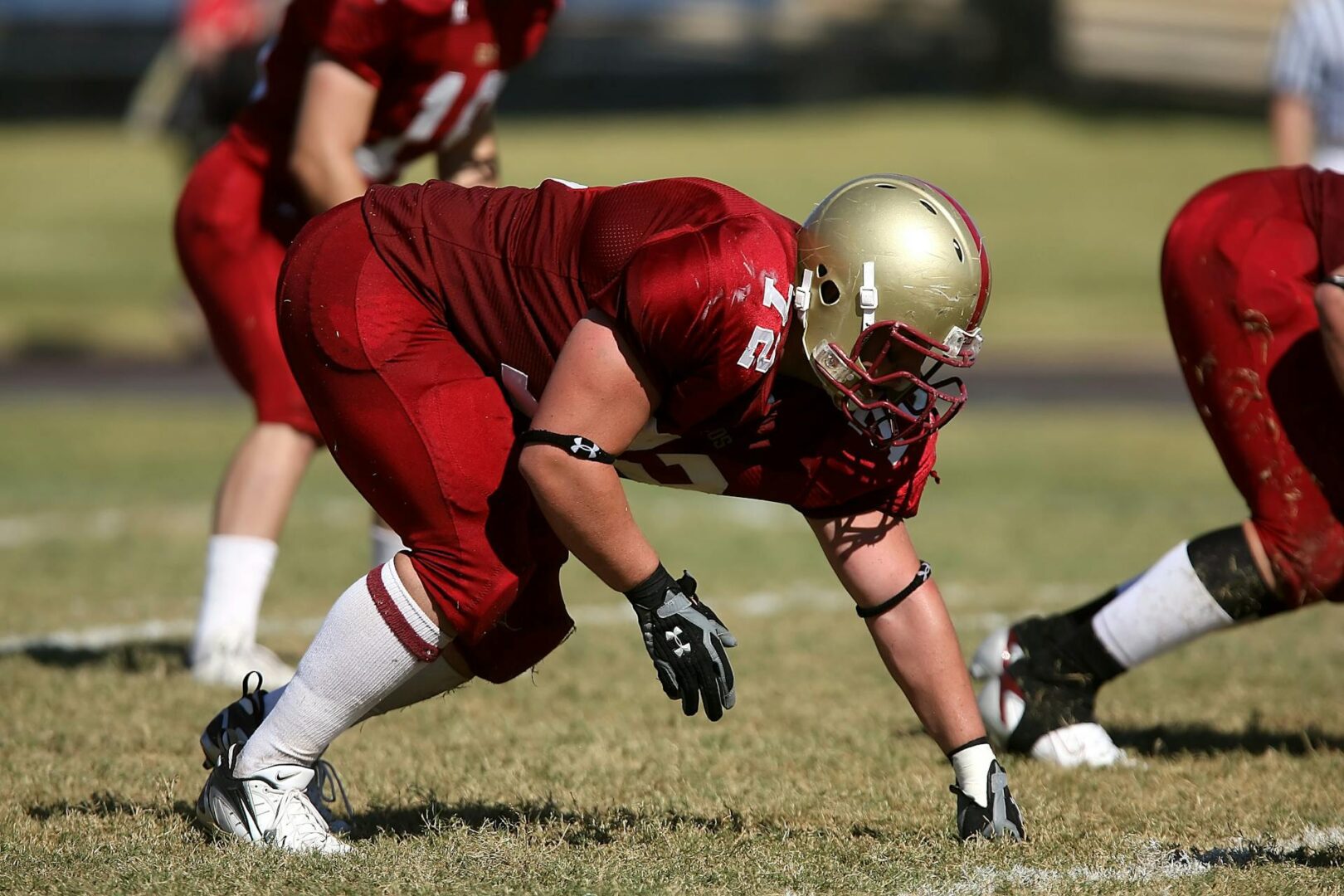 A football player in red is on the field